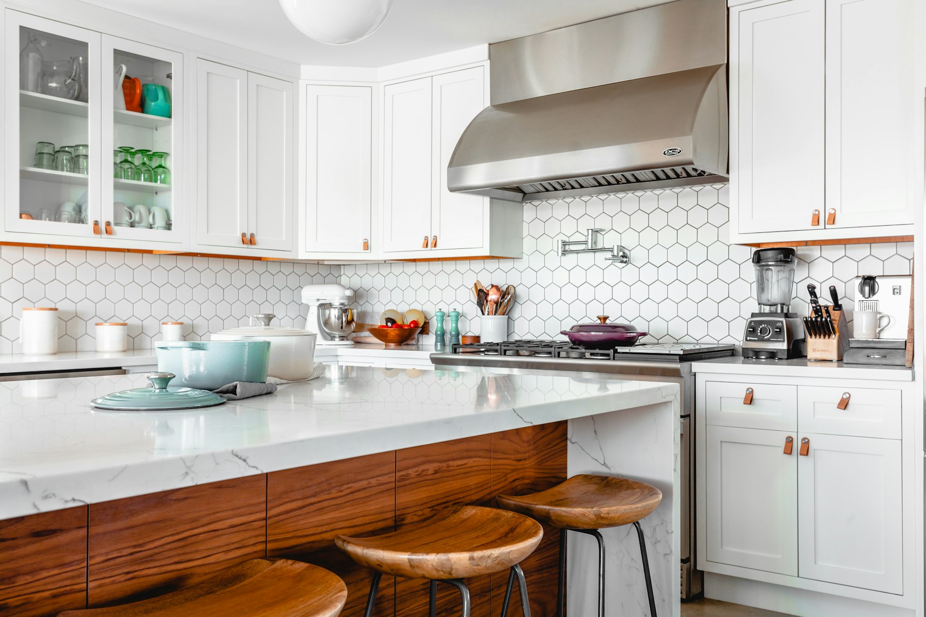 Modern kitchen with custom cabinetry and stone countertops